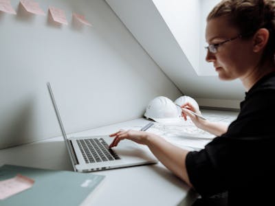 Property surveyor inspecting home
