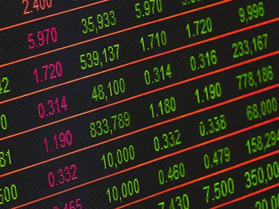 Calculator and house model showing costs